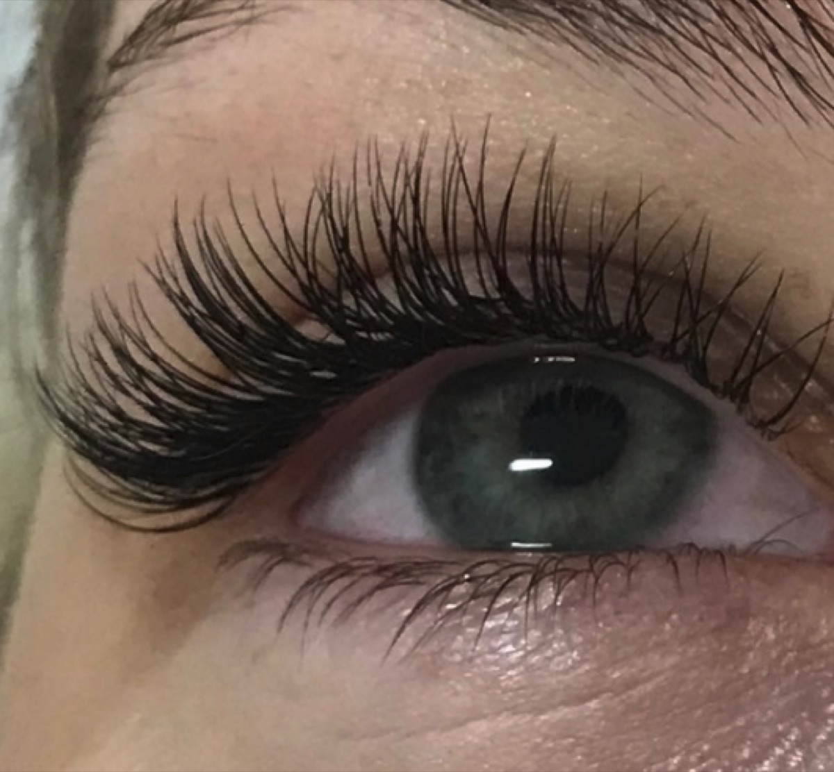 Defined brow and lash work close-up